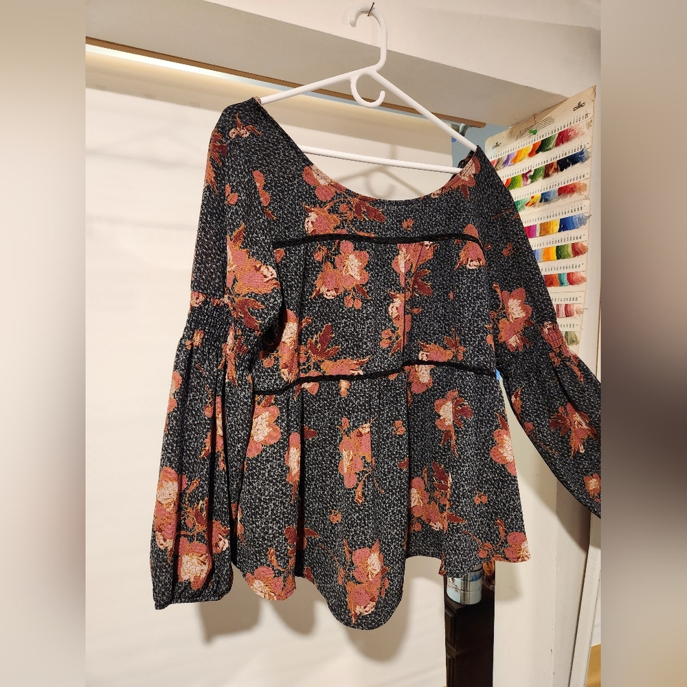 This is a wide neck peasant top